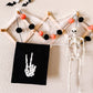 skeleton peace sign hang sign