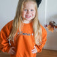 Custom Embroidered Orange Crewneck Sweatshirt or Romper - Floral Bow