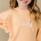 Sweatshirt mit Rundhalsausschnitt und individueller Stickerei - Creamsicle Orange