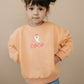 Sweatshirt mit Rundhalsausschnitt und individueller Stickerei - Creamsicle Orange