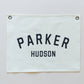 Custom canvas baby name banner in white with black letters Parker Hudson from Little Joy Co